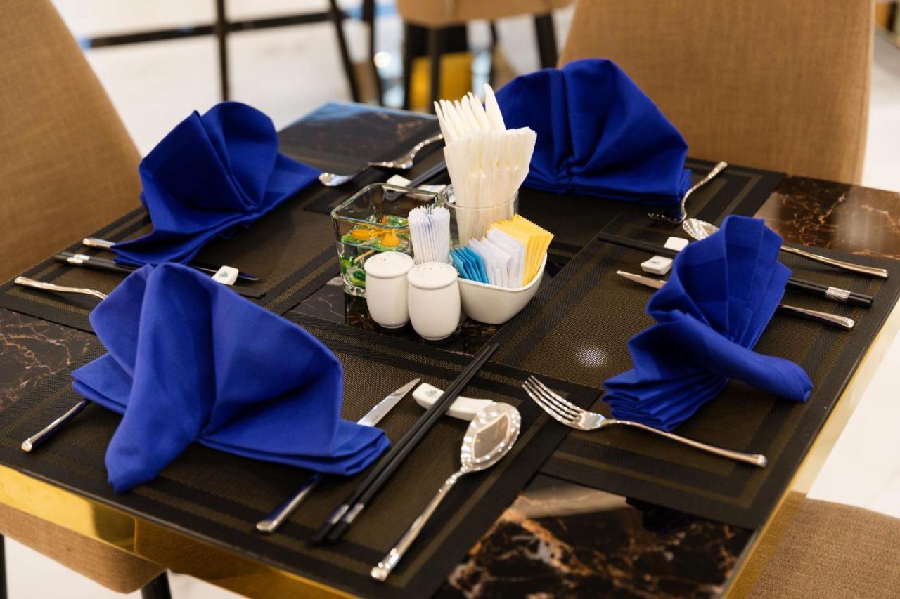 Virgo Hotel Nha Trang Buitenkant foto A table set for fine dining